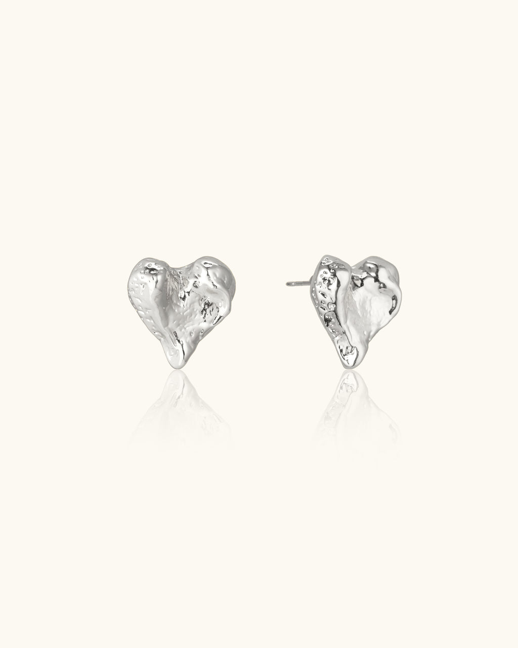 Carved Heart Earrings In Silver